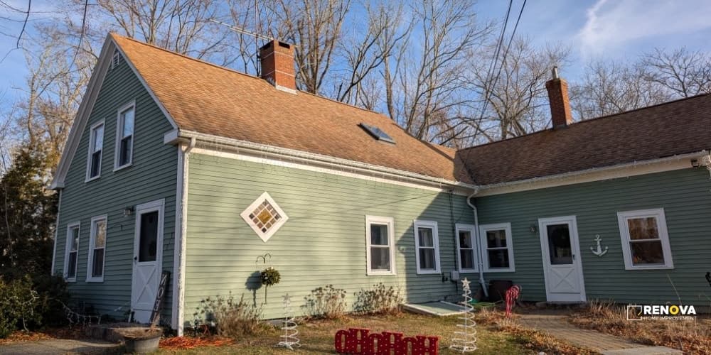 Aerial view of an older shingle roof before replacement